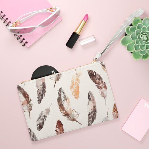 Boho feather clutch bag with vibrant seamless pattern for free-spirited fashionistas.
