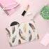 Boho feather clutch bag with vibrant seamless pattern for free-spirited fashionistas.