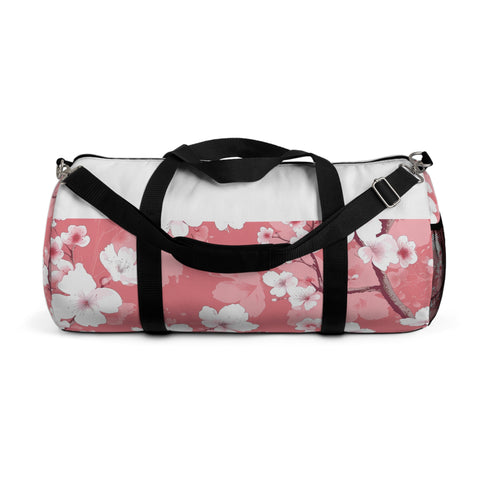 Pink and white cherry blossom print duffel bag, ideal for travel or workouts.