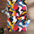 Bright abstract rubber yoga mat with bold seamless pattern for balance.