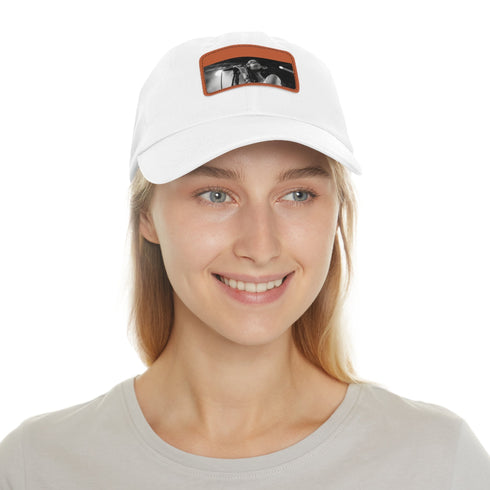 Stylish white hat with light brown patch, perfect for music lovers.