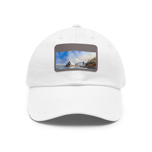 White baseball cap with light brown Sydney skyline patch.