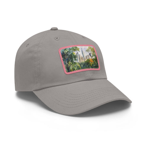 Central Park skyline watercolor baseball cap in white with light brown patch.