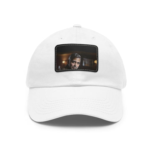 Clooney Crown white baseball cap with light brown patch.