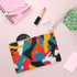 Bright abstract clutch bag with seamless bold color pattern for statement style.