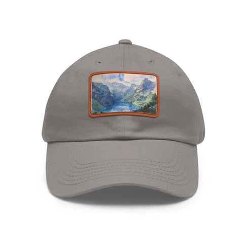 Swiss Alps watercolor baseball cap with light brown patch.