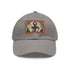 Nautical anchor design white baseball cap with light brown patch.