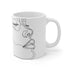 Sleek black ceramic mug with minimalist abstract face design.