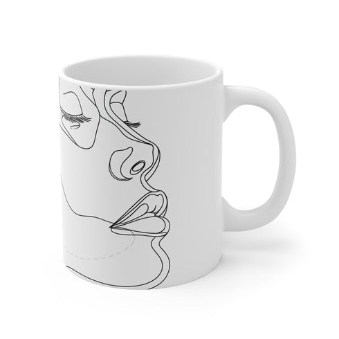 Sleek ceramic coffee mug with abstract face design.