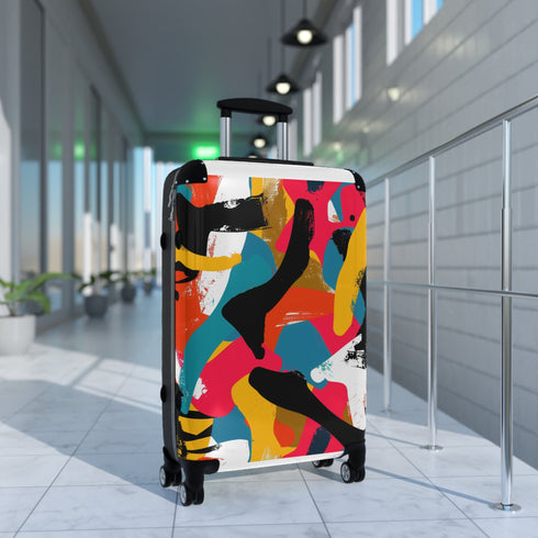 Abstract bright colorful suitcase set with bold modern geometric pattern design.