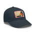 Abstract geometric design white cap with light brown rectangle patch.