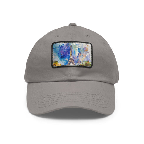 Eiffel Tower watercolor baseball cap, white with light brown patch.