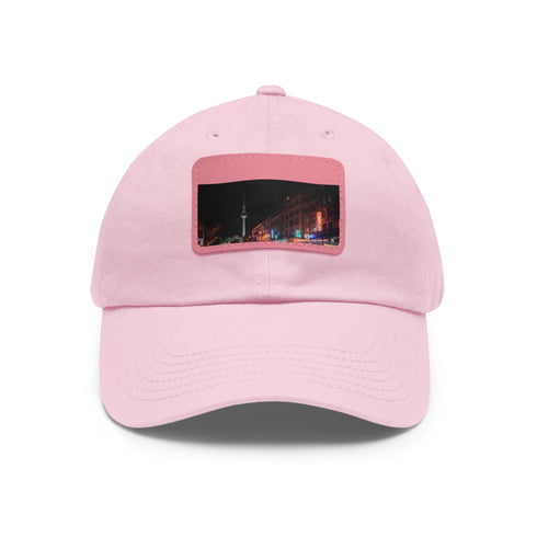 Nighttime Berlin skyline baseball cap in white with light brown patch.