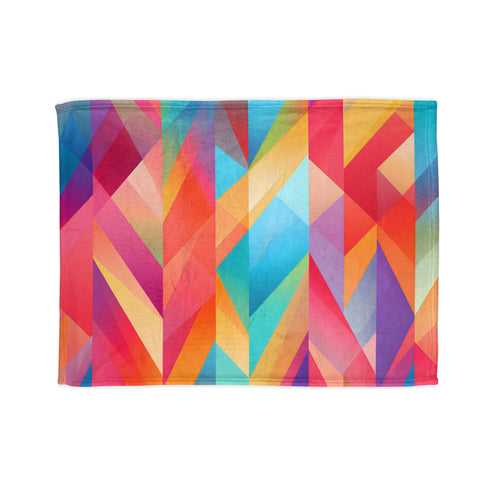 Vibrant summer hues blanket with abstract geometric patterns for cozy rest.