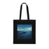 Minimalist black cotton tote featuring majestic whale swimming in deep blue.
