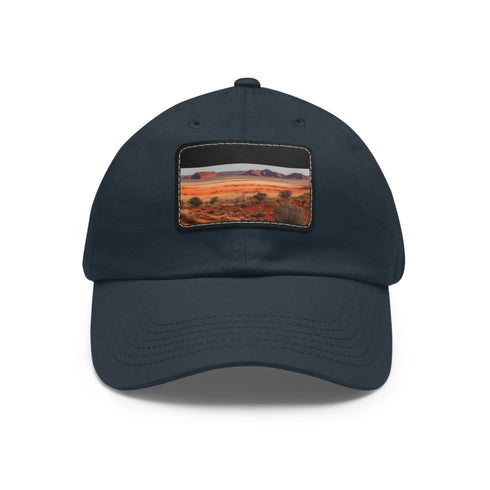 Desert landscape baseball cap with rock formations, white/light brown patch.