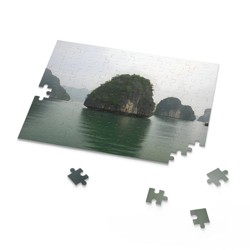 Scenic Halong Bay jigsaw puzzle with emerald waters and limestone formations.
