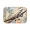 Alt text: Vintage-inspired Airborne Adventures Bath Mat featuring a classic airplane silhouette with colorful travel stamps, perfect for adding a touch of wanderlust to your bathroom decor. Size: 24 x 17. Made with high-quality material, comfortable, stylish, and suitable for all seasons. Makes a great gift. Shop more at BenCPrints.