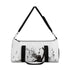 Stylish small duffel bag with dancer silhouette and musical notes.