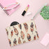 Boho Feathers Clutch Bag with intricate feather pattern, vegan material.