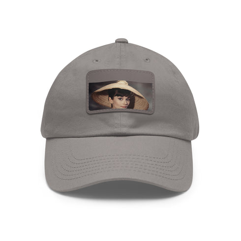 Audrey Hepburn monochrome baseball cap with light brown patch.