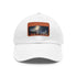 White cotton London Night baseball cap with light brown rectangle patch.