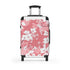 Cherry blossom small black suitcase with pink and white pattern.