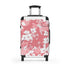 Cherry blossom black small travel suitcase with pink and white pattern.
