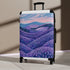 Small black Lavender Fields suitcase with seamless floral pattern for travel.