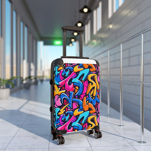Vibrant neon graffiti suitcase set for stylish urban travelers.