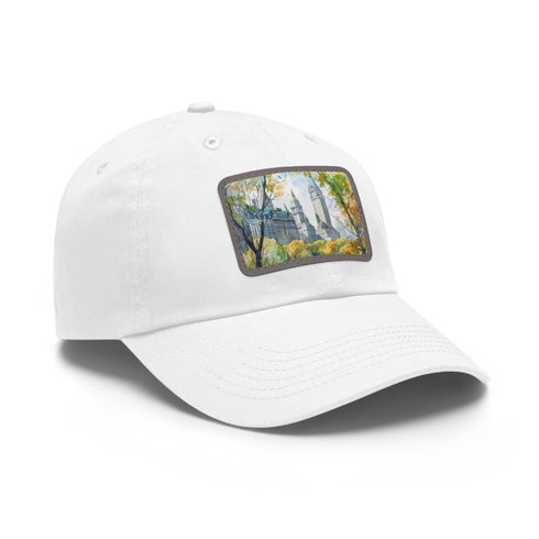 Central Park watercolor baseball cap with light brown patch.