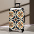 Handcrafted black artisan suitcase with seamless tile pattern for chic travel.