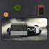 Luxurious Bugatti Speed Demon Desk Mat with sleek high-speed driving design.