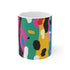 Abstract bright ceramic coffee mug with bold seamless pattern.