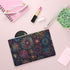 Vibrant multi-color clutch bag with festive fireworks pattern.