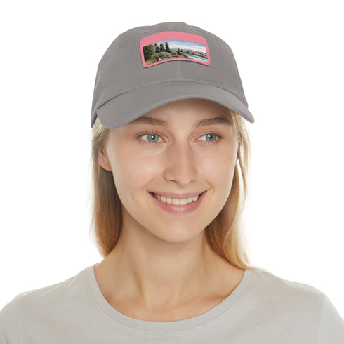 White baseball cap with tranquil Kiwi Lake Adventure patch.