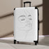 Chic minimalist face-inspired small black suitcase for stylish travel.
