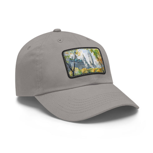 Central Park watercolor baseball cap with landmarks on white patch.