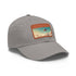 White cotton baseball cap with futuristic urban skyline design.