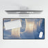 Ice Pillars Rising from Cosmic Sea Gaming XXL Extended Desk Mat