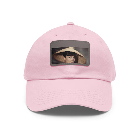 Audrey Hepburn monochrome baseball cap with light brown rectangle patch.