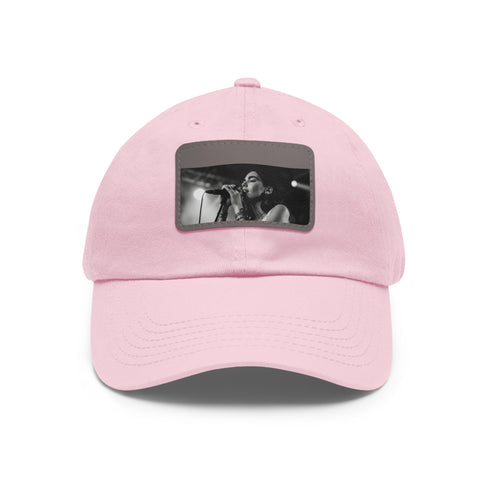 White cotton unisex Dua Lipa melody snapback hat with light brown patch.