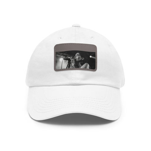 White cotton Dua Lipa Melody Snapback hat with light brown rectangle patch.