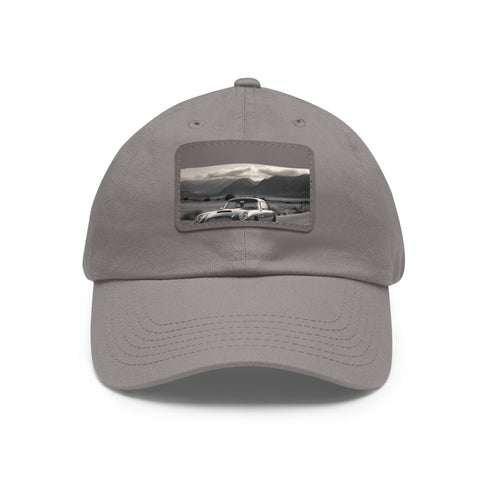 White cotton Aston Martin DB5 baseball cap with light brown patch.