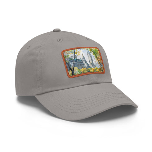 Central Park watercolor baseball cap with light brown patch.