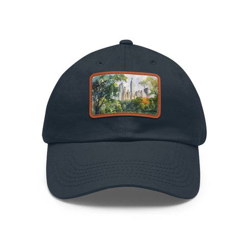 Central Park skyline watercolor baseball cap, white with light brown rectangular patch.