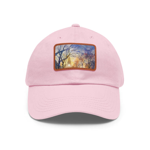 Eiffel Tower watercolor baseball cap in white with light brown patch.