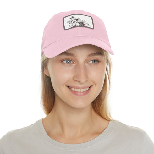 Hand-drawn floral white baseball cap with light brown patch.