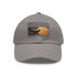 Black copper gold baseball cap with abstract design for sophisticated outfit.