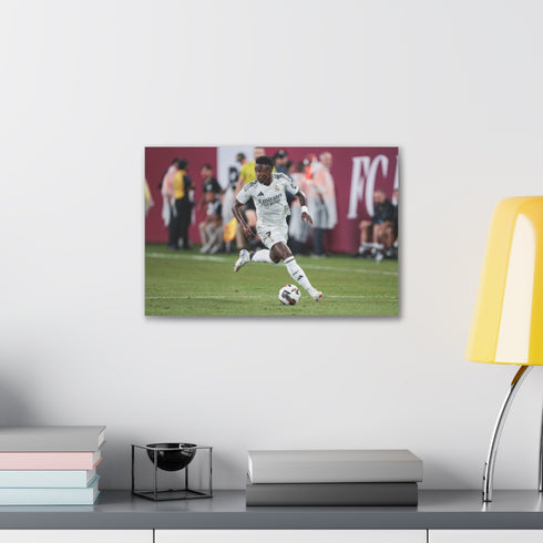 Vibrant canvas print capturing Vinicius Jr.'s Samba Magic on the Pitch.